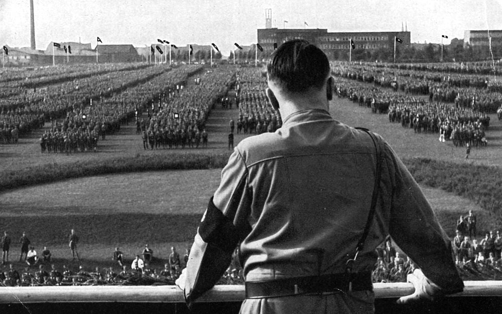 This image has an empty alt attribute; its file name is hitler-parade-xlarge.jpg
